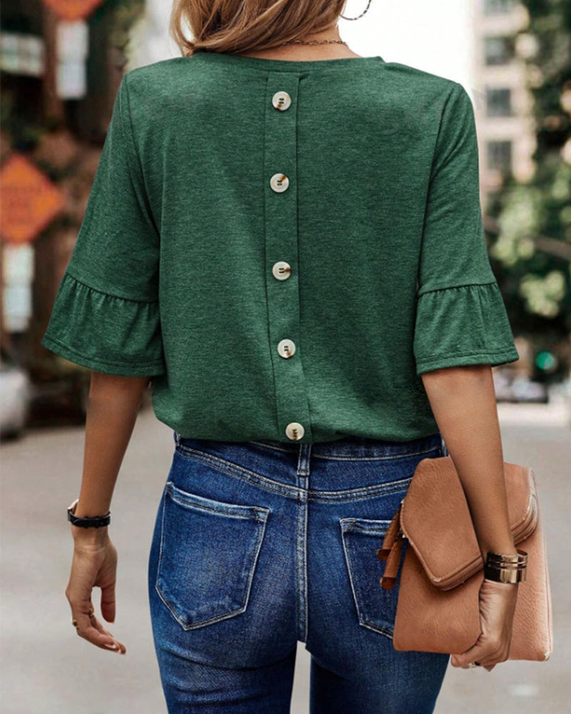 Haut élégant boutonné au dos de couleur unie