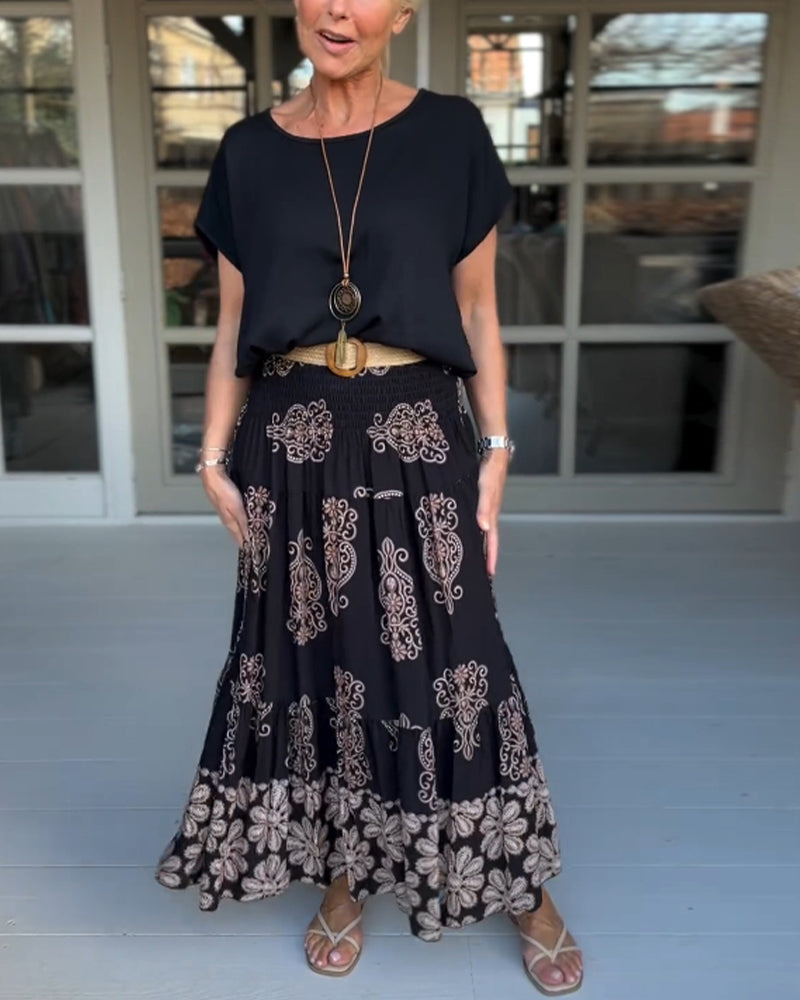 Jupe à empiècements fleuris et plis