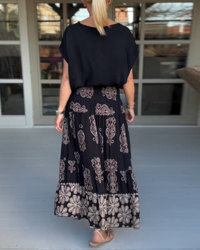 Jupe à empiècements fleuris et plis