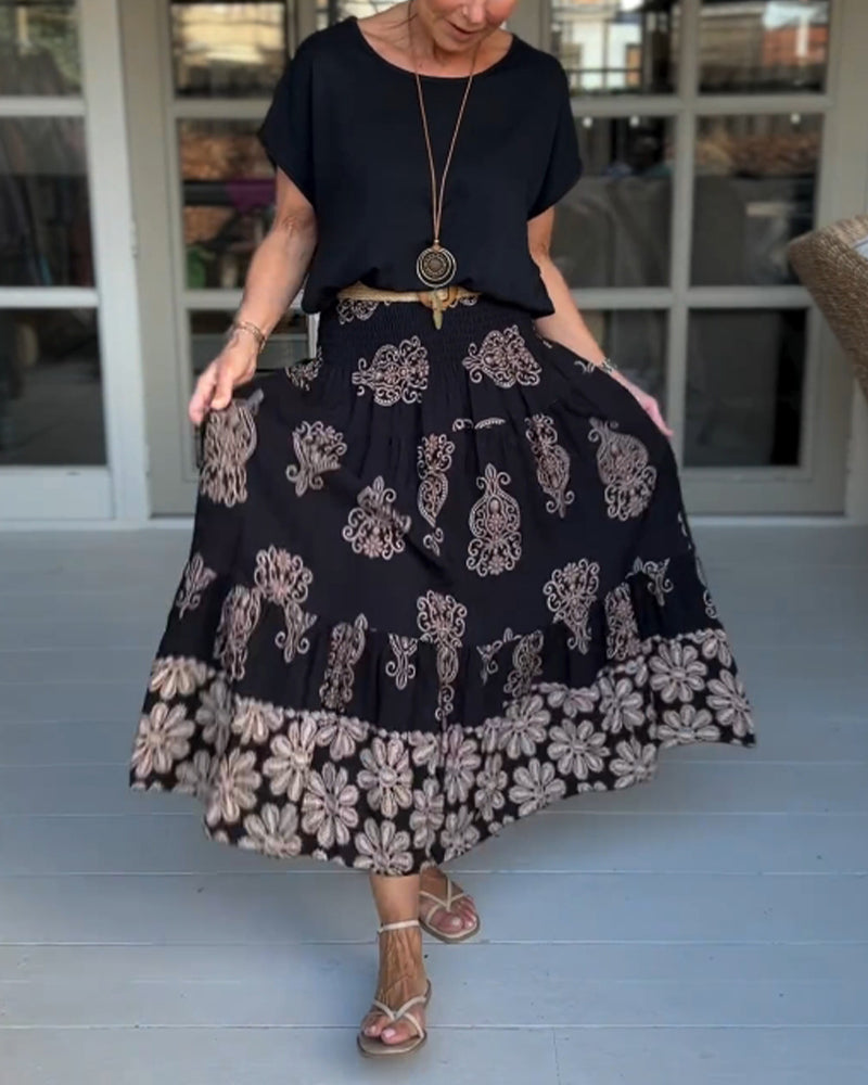 Jupe à empiècements fleuris et plis