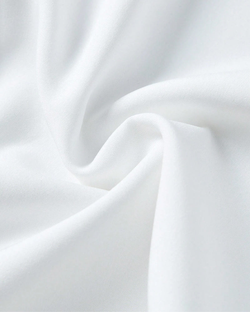 Chemise unie à volants et revers