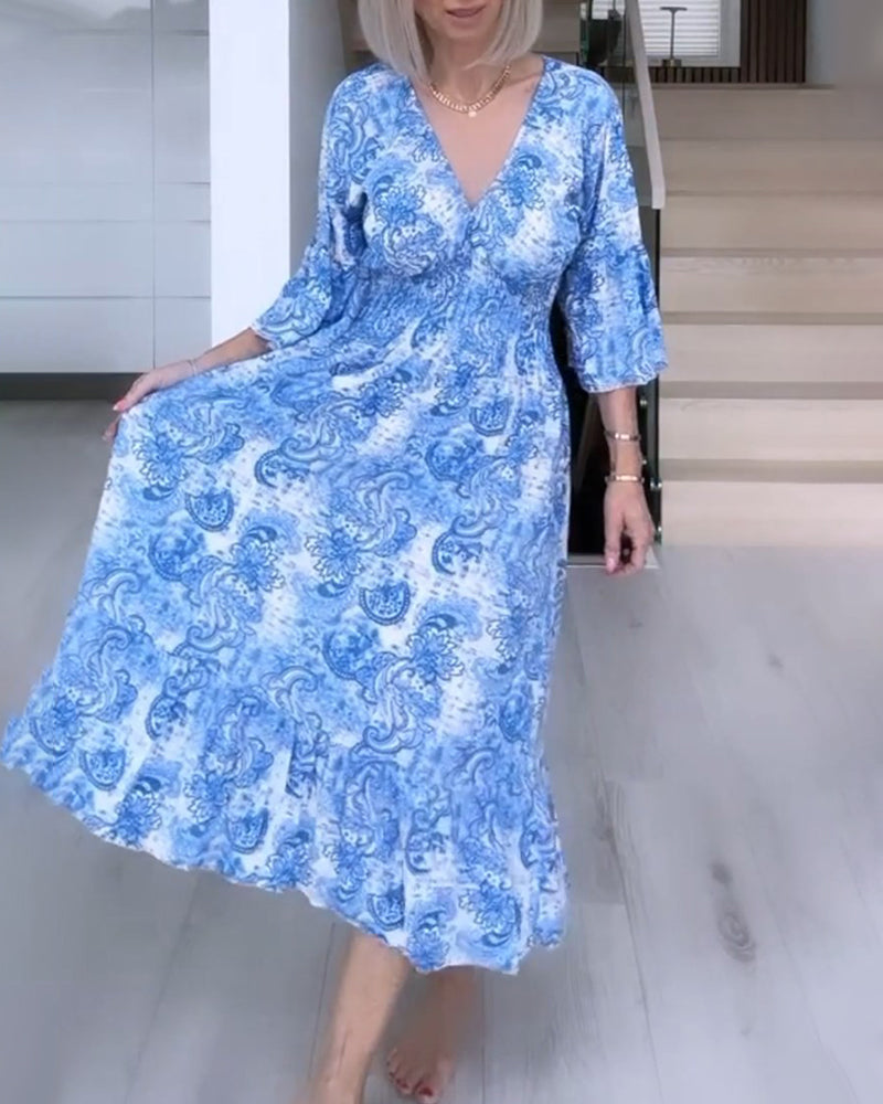 Robe fluide imprimée ceinturée col V