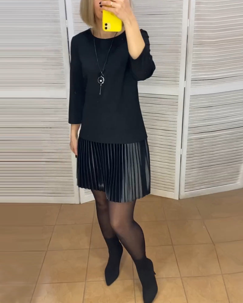 Robe à pans plissés et couleurs unies