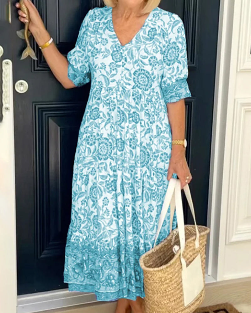 Robe bleue à imprimé floral et col en V