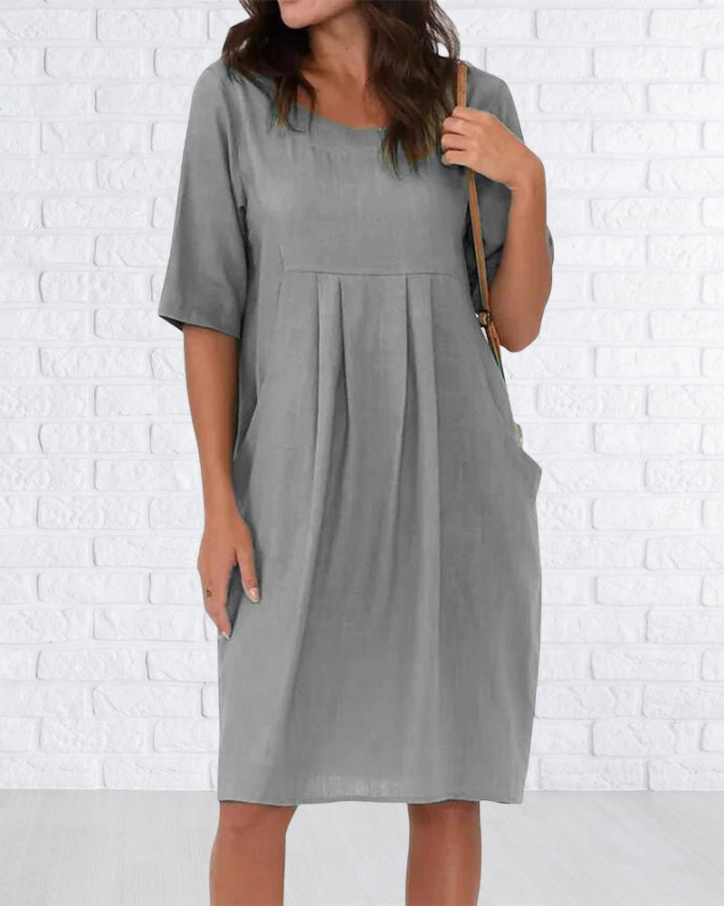 Robe de couleur unie à col rond avec poches