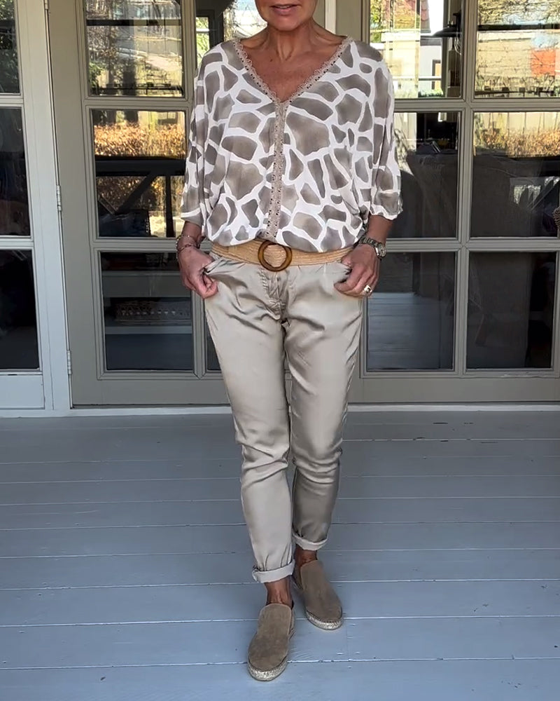 Blouse élégante imprimée col V manches chauve-souris