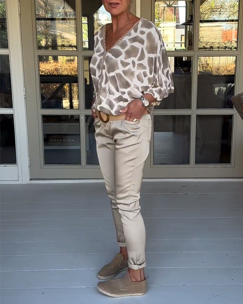 Blouse élégante imprimée col V manches chauve-souris