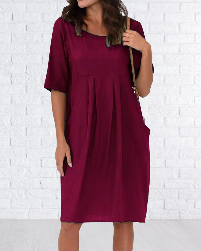 Robe de couleur unie à col rond avec poches