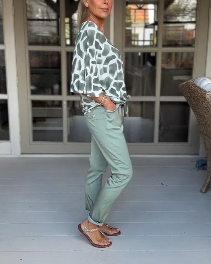 Blouse élégante imprimée col V manches chauve-souris