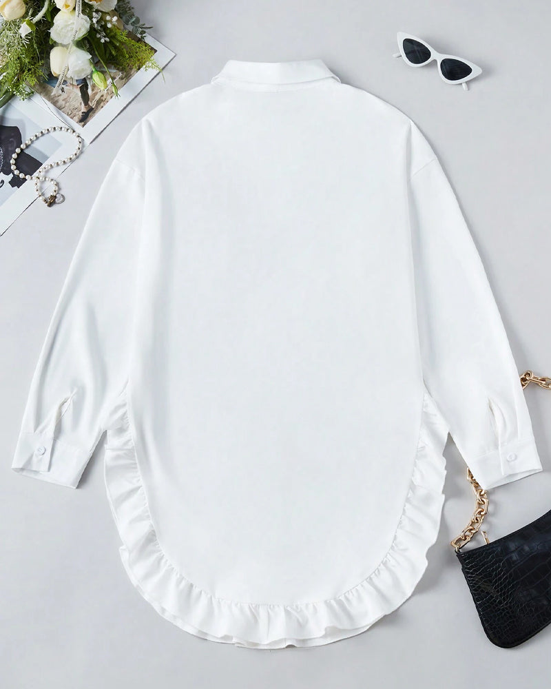 Chemise unie à volants et revers