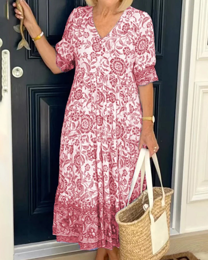 Robe bleue à imprimé floral et col en V