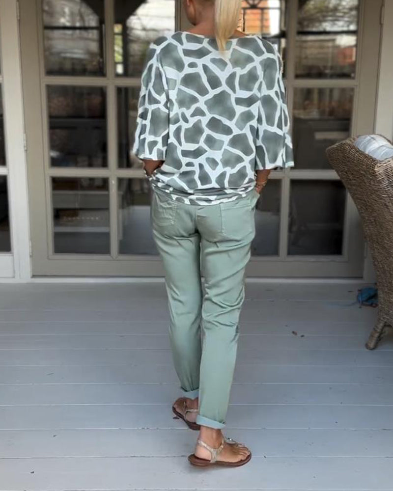 Blouse élégante imprimée col V manches chauve-souris