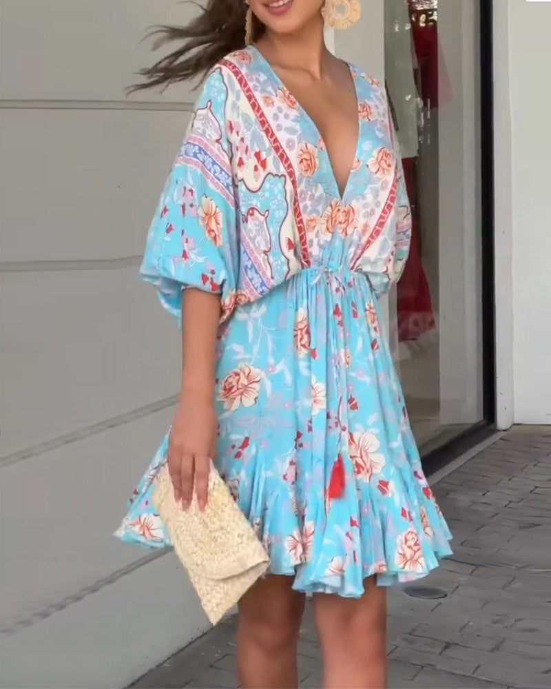 Robe élégante à imprimé floral et col en V
