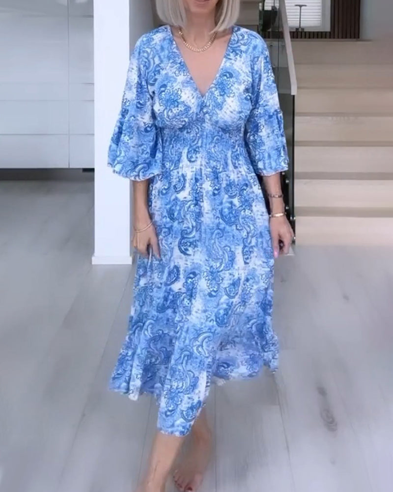 Robe fluide imprimée ceinturée col V