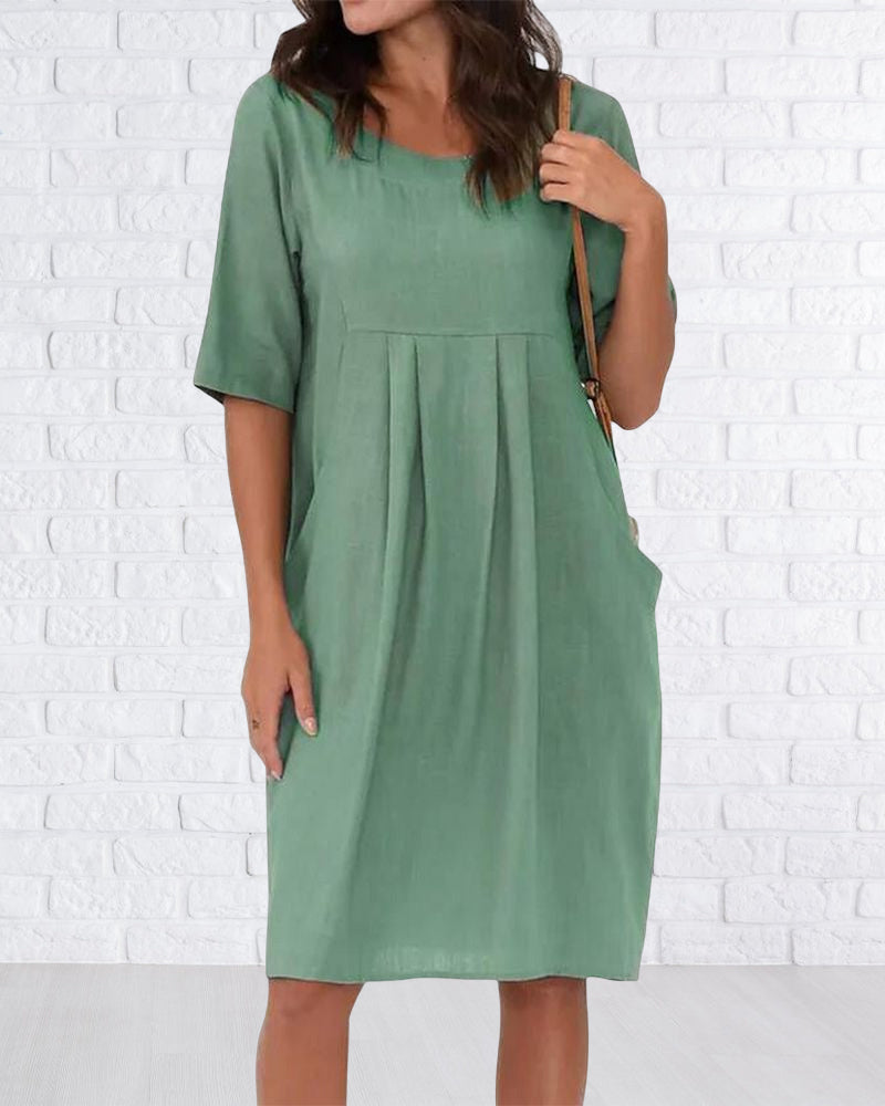 Robe de couleur unie à col rond avec poches
