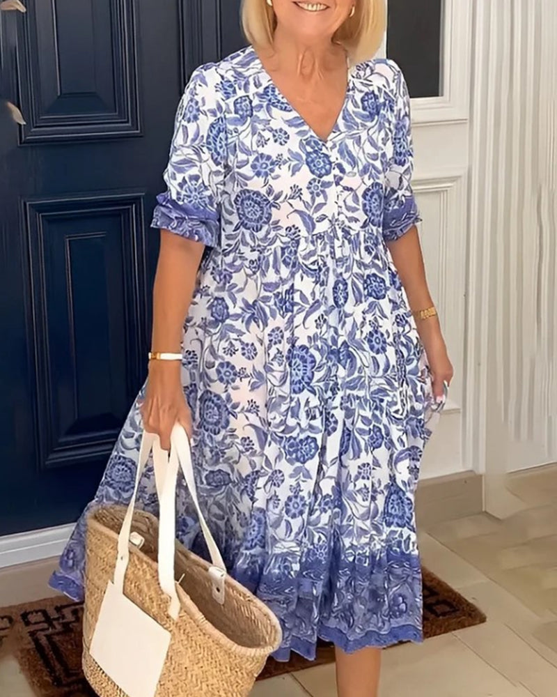 Robe bleue à imprimé floral et col en V