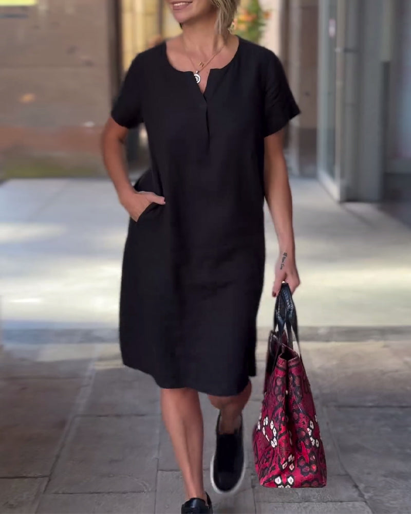 Robe de poche à manches courtes et col en V de couleur unie
