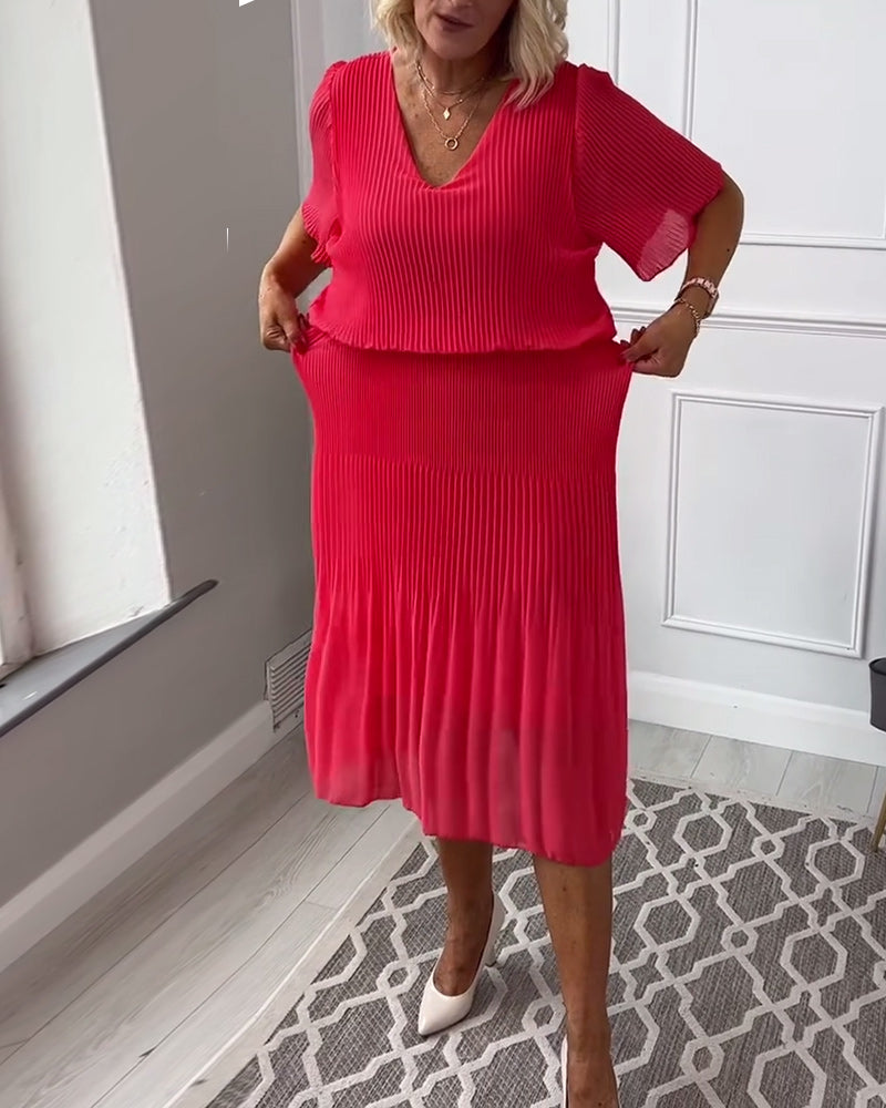 Robe plissée décontractée à col en V et demi-manches de couleur unie