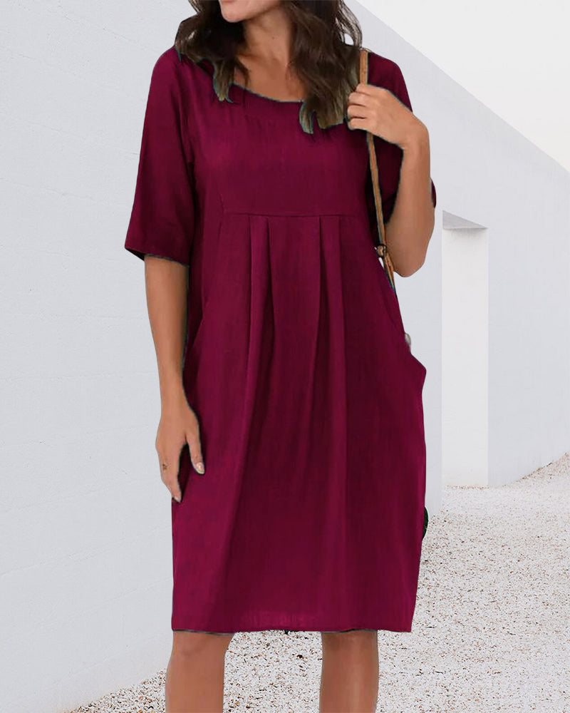 Robe de couleur unie à col rond avec poches