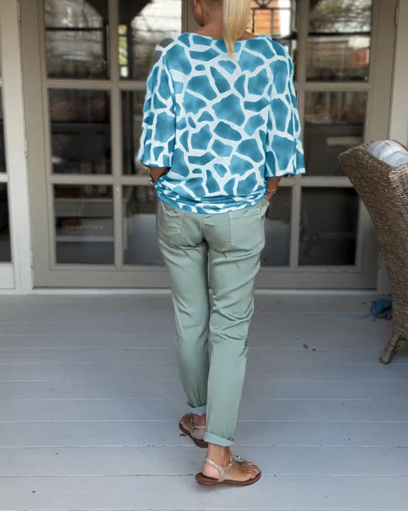 Blouse élégante imprimée col V manches chauve-souris