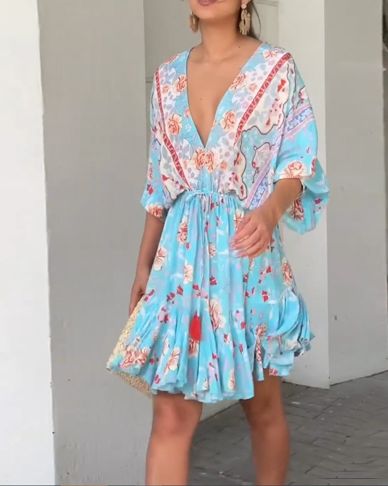 Robe élégante à imprimé floral et col en V
