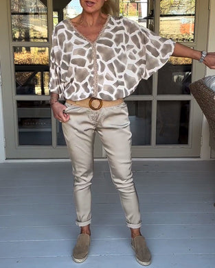 Blouse élégante imprimée col V manches chauve-souris