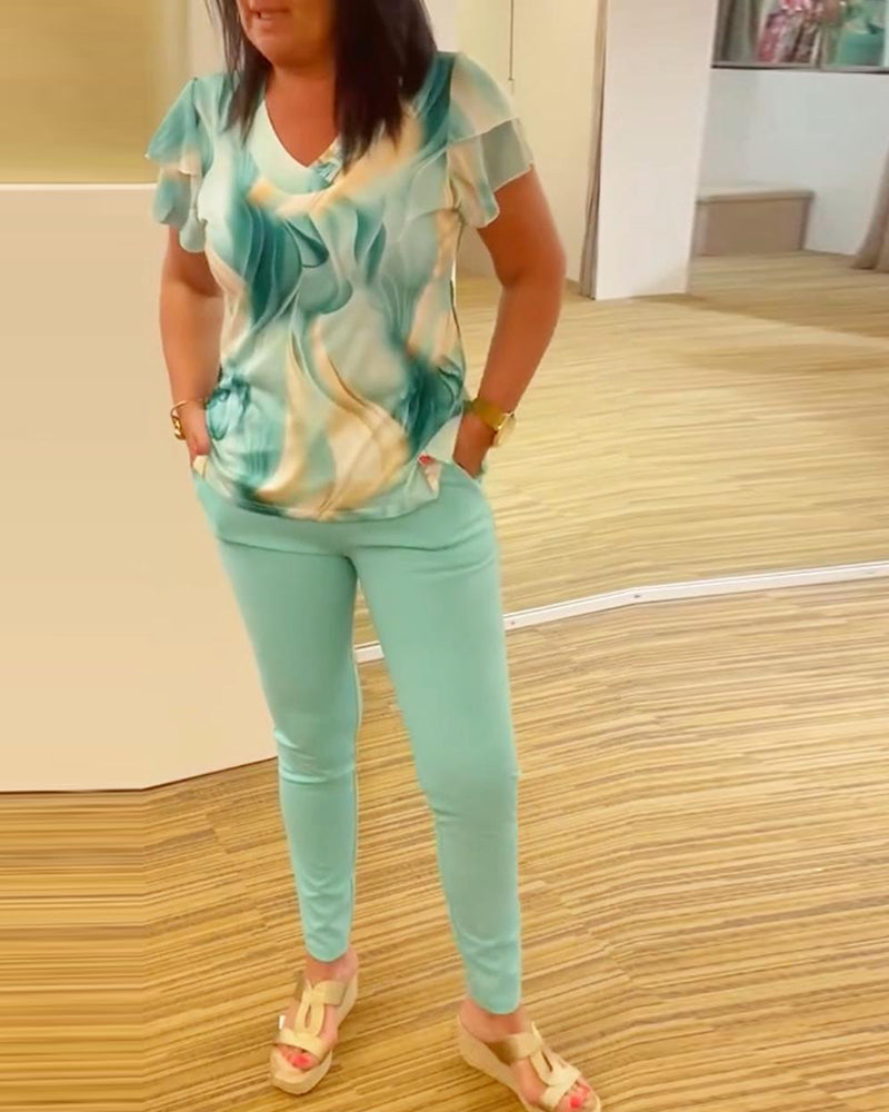 Blouse col V imprimée manches volantées patchwork