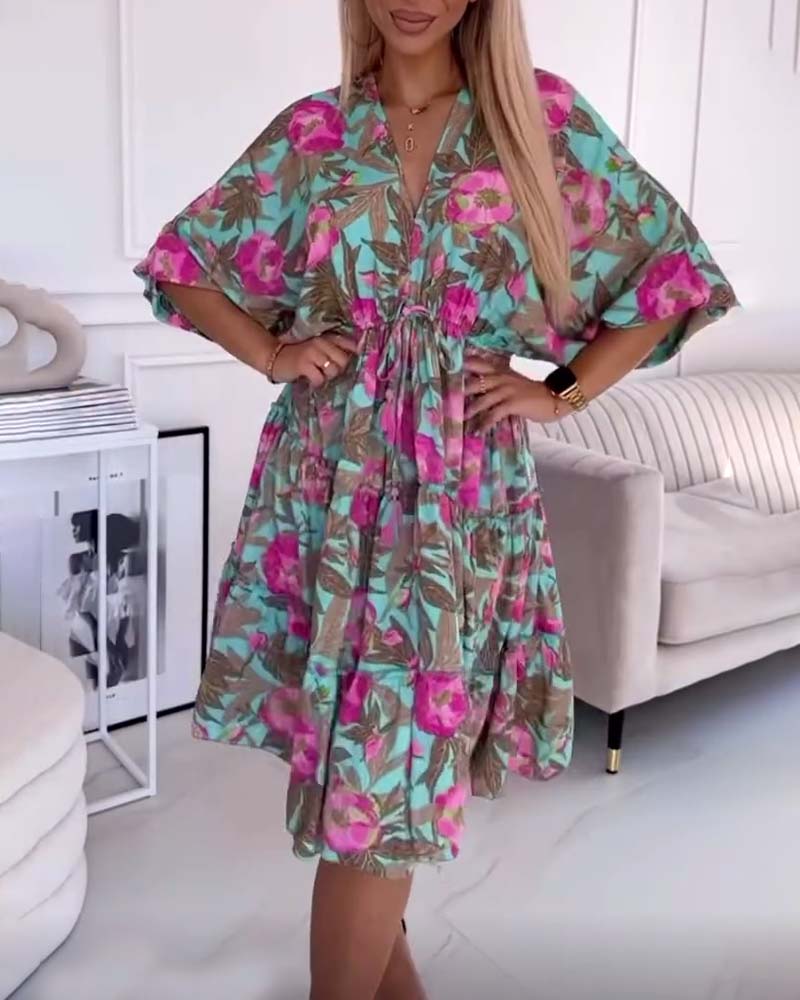 Robe élégante avec cordons de serrage et imprimé floral