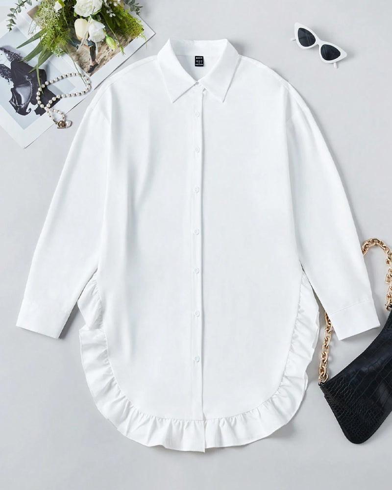 Chemise unie à volants et revers