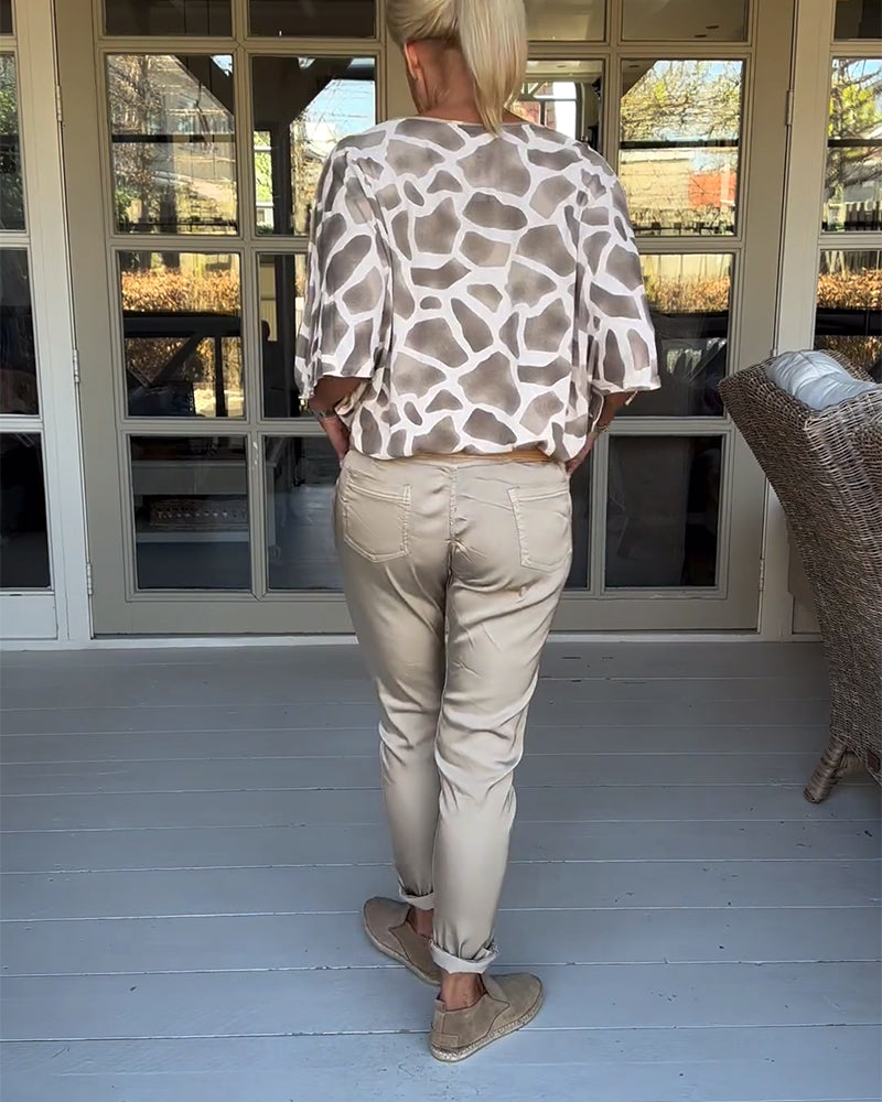 Blouse élégante imprimée col V manches chauve-souris