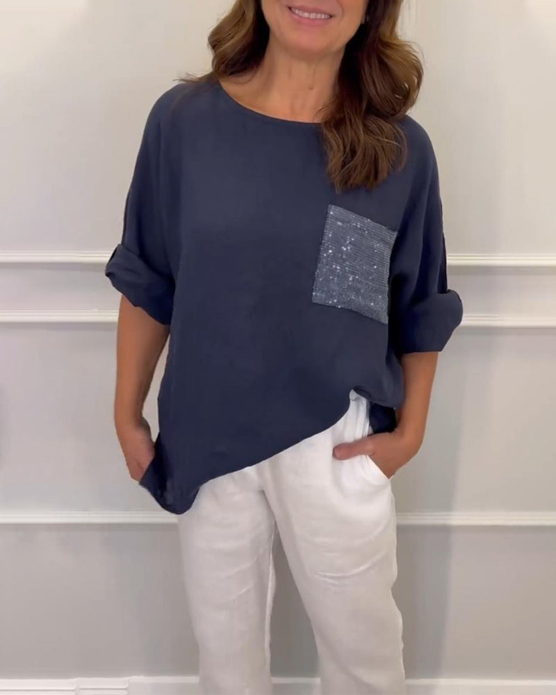 Haut ras du cou à poches et sequins
