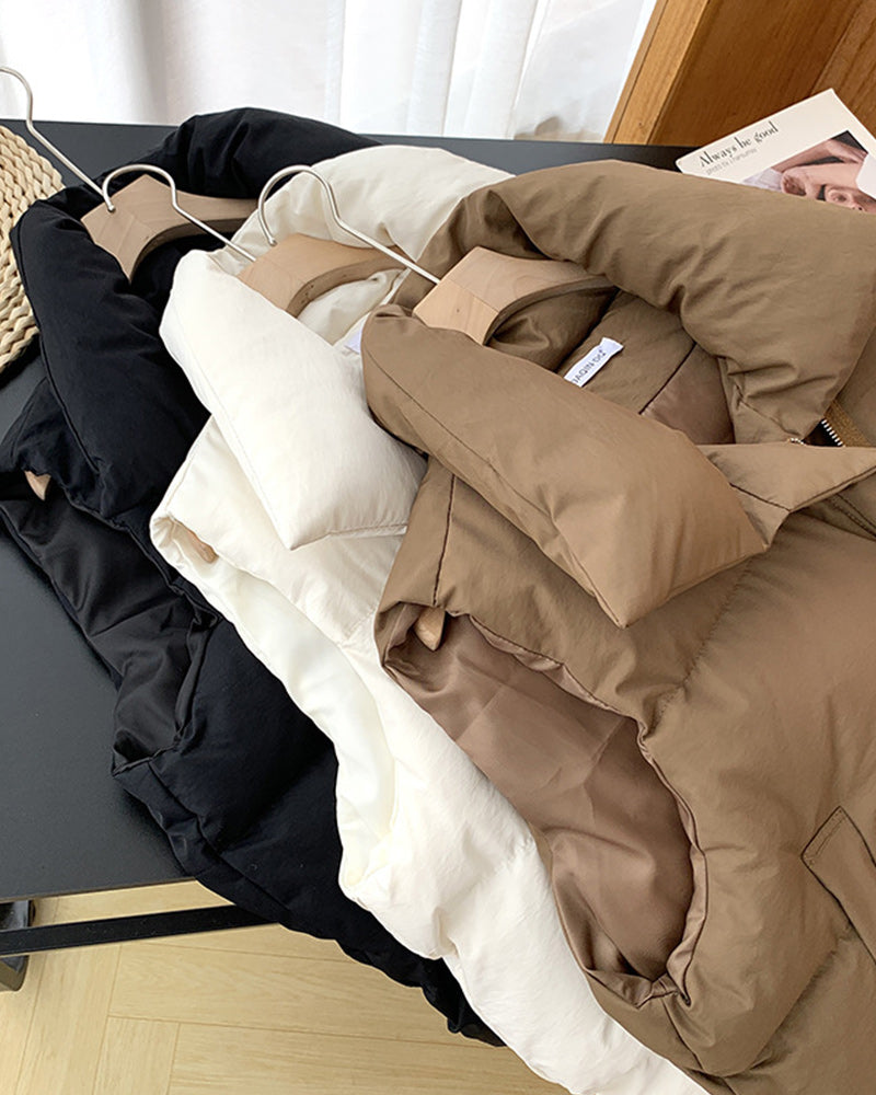 Veste matelassée simple sans manches avec poche zippée de couleur unie