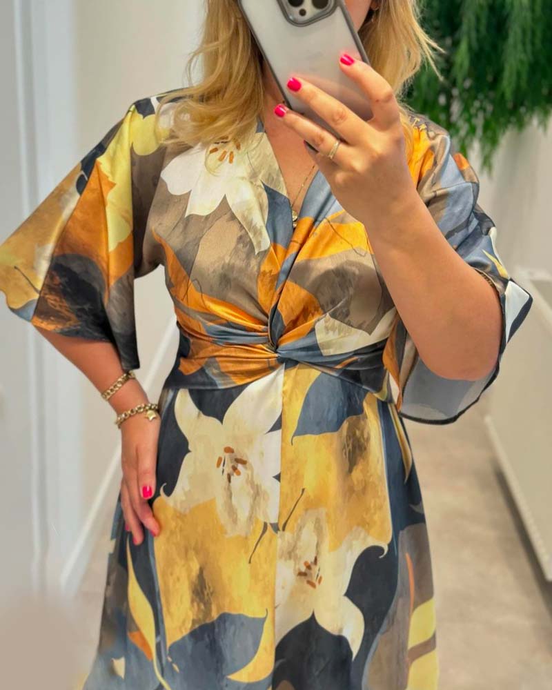 Robe élégante à col en V torsadé à imprimé floral