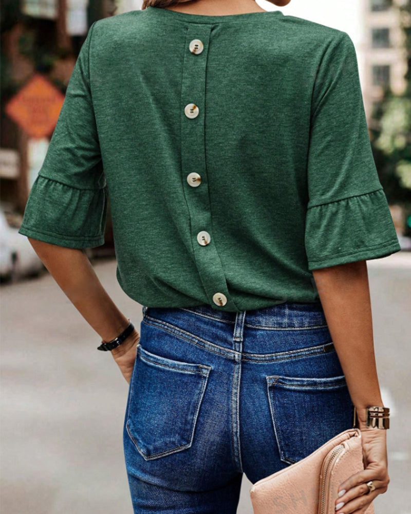 Haut élégant boutonné au dos de couleur unie